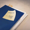 An image of an evidence folder. On it is a postit that says "Lamberg 1988"