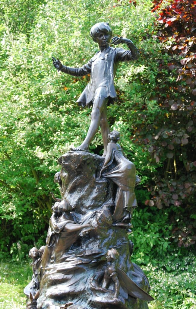 A bronze statue of Peter Pan in Kensington Gardens