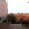The view from the top of the stairs at Finntrappan. Below you can see the red roofs of all the little cottages, and the ocean beyond them.